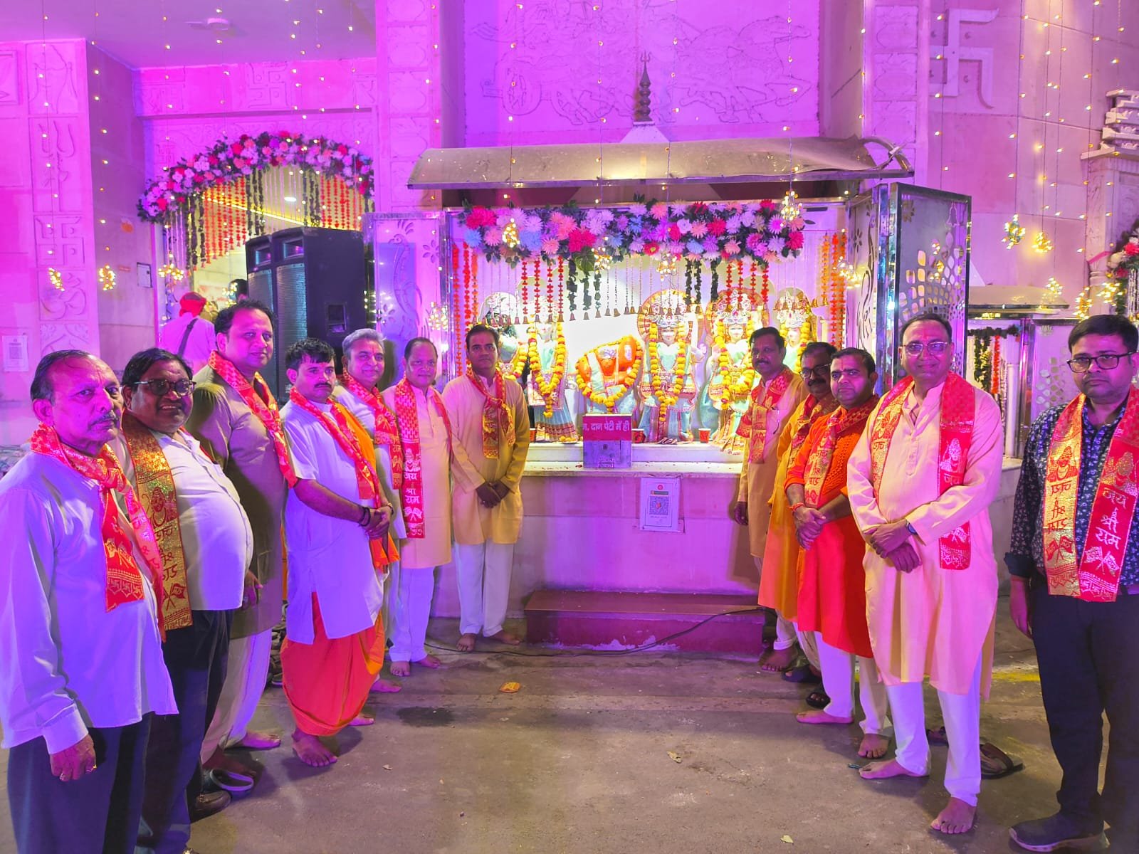Devotees attending a grand bhajan sandhya and prasad distribution program at Purvamukhi Hanuman Temple in Sanjay Place, Agra.