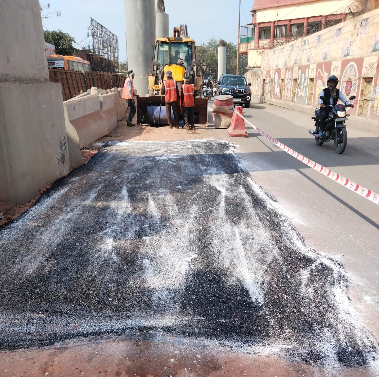 Road restoration and resurfacing work completed near Agra Metro Second Corridor construction site with smooth traffic movement in Agra