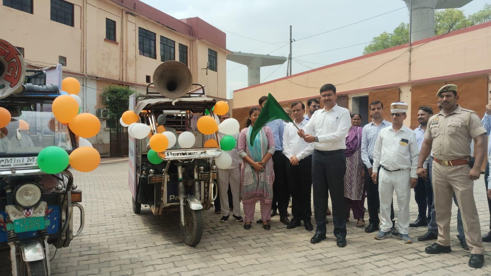 District Magistrate Manish Bansal flagging off e-rickshaw awareness vehicle on World Child Labour Day in Agra