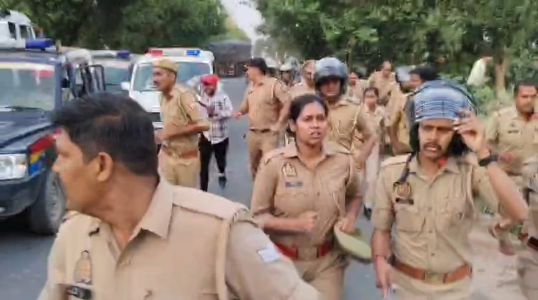 Villagers confront and chase police officers during a violent protest on the Fatehabad–Firozabad Road in Agra following a fatal road accident.