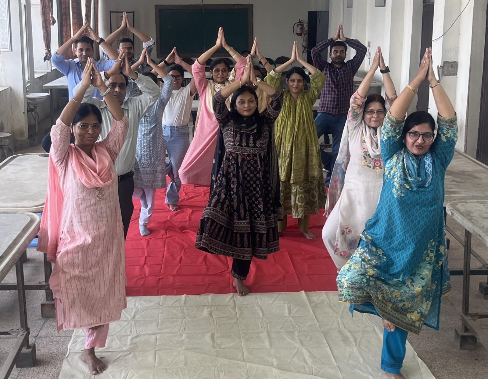 Doctors, nursing staff and students practicing pranayama during Yoga Week at SN Medical College Agra