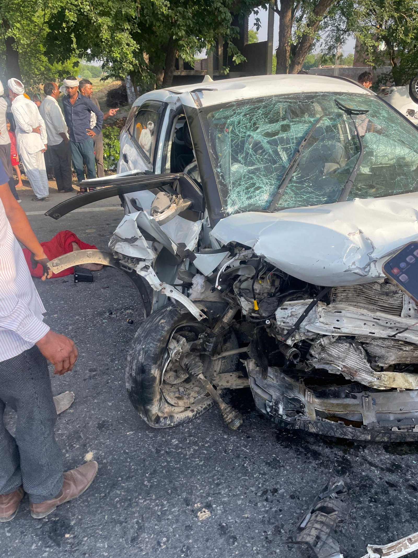 Damaged cars after a head-on collision on the Agra-Gwalior Highway near Saiyan following a tyre burst that killed three people and injured 12 others.