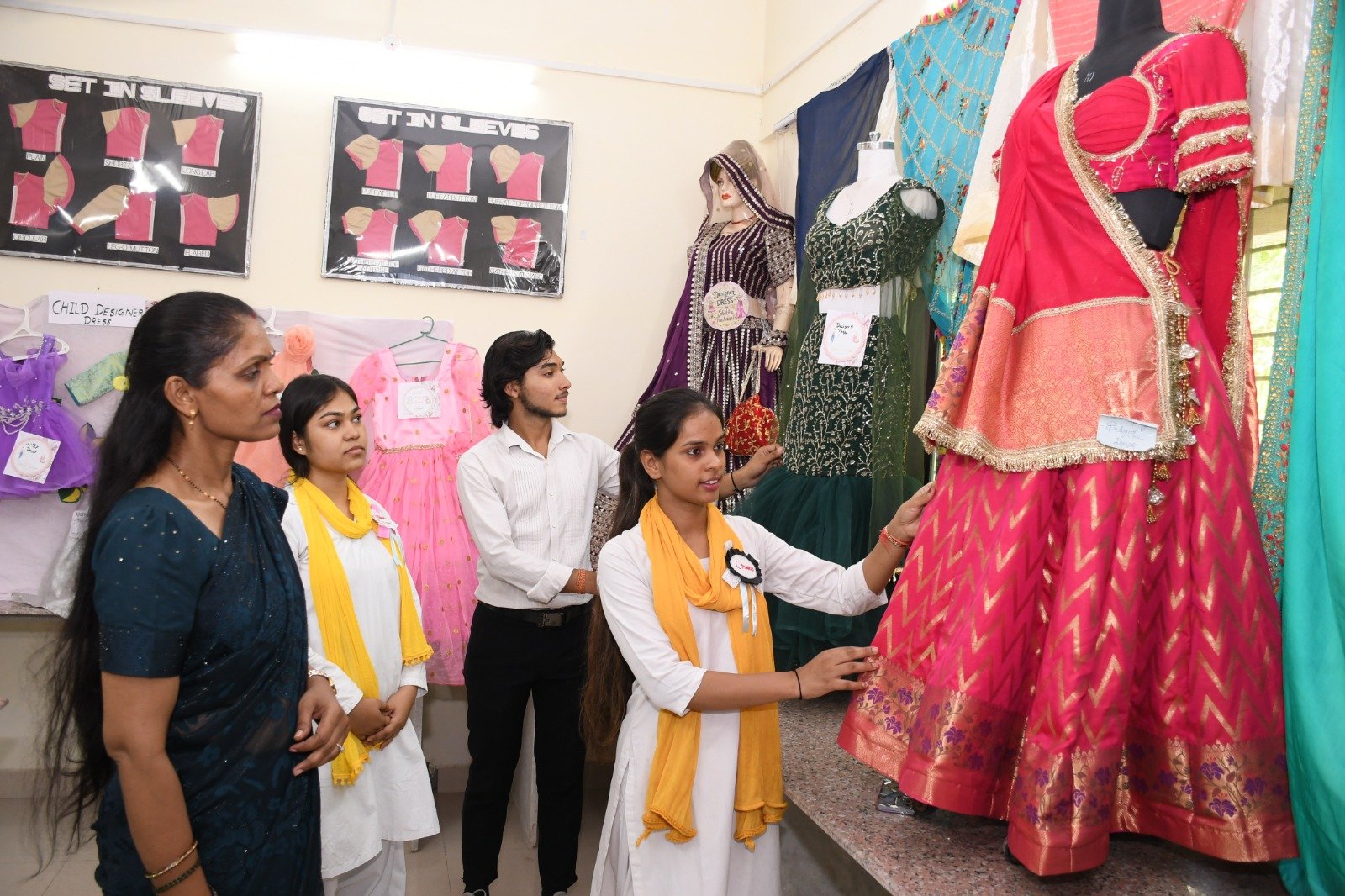 Students showcase designer garments and innovative fashion products during the Apparel Designing Exhibition at the Institute of Home Science, Dr. Bhimrao Ambedkar University, Agra.