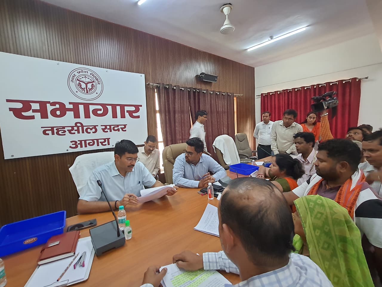 District Magistrate Manish Bansal listening to public grievances during Sampoorna Samadhan Diwas at Tehsil Sadar in Agra.