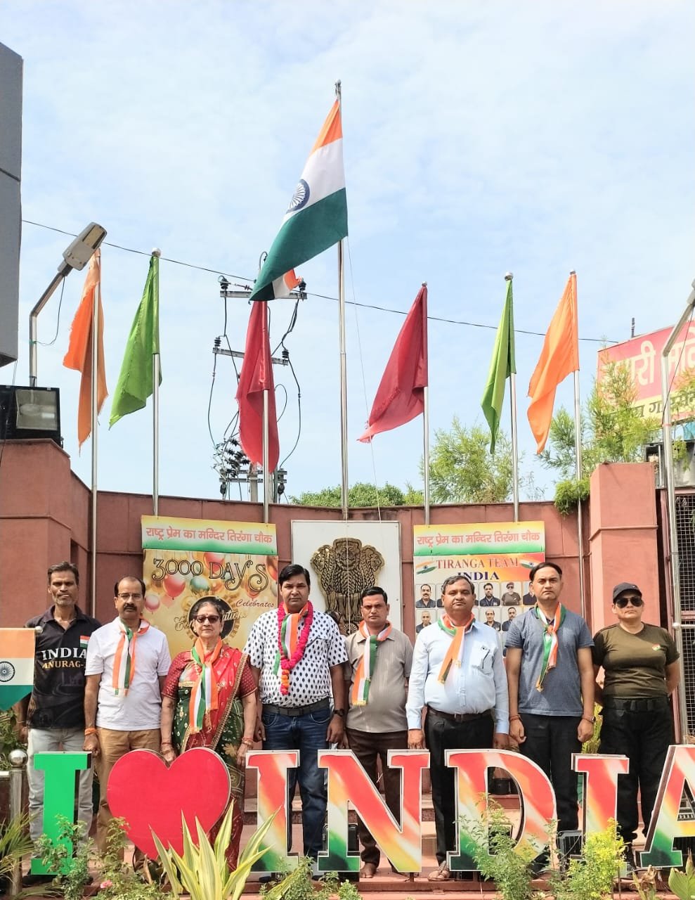 Social worker Chaturbhuj Tiwari and local residents participate in a flag hoisting ceremony at Tiranga Chowk, Kheria Mod, Agra.
