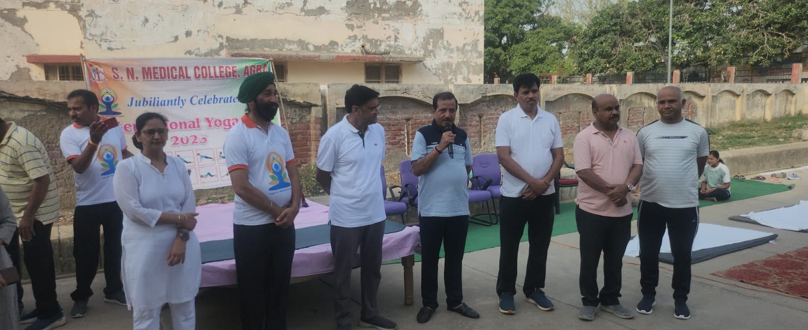 Doctors, faculty members and students perform yoga during International Yoga Day 2026 celebrations at SN Medical College Agra.