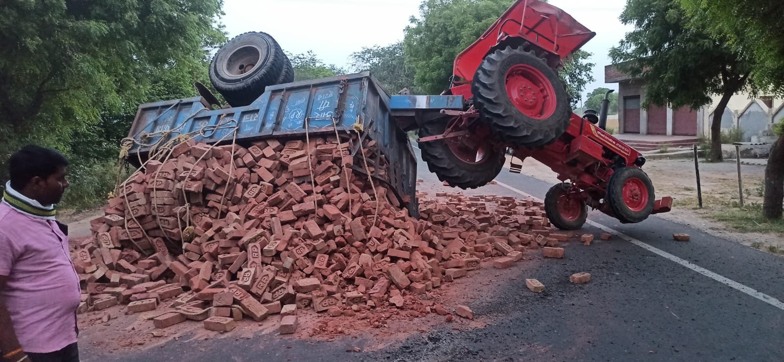 A brick-loaded tractor overturned after being hit from behind by a DCM truck on the Bah–Fatehabad road near Baba Ki Tiwariya in Agra district.