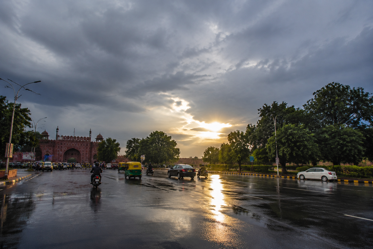 Dark monsoon clouds over Agra after afternoon rainfall as sunshine returns, increasing humidity across the city.