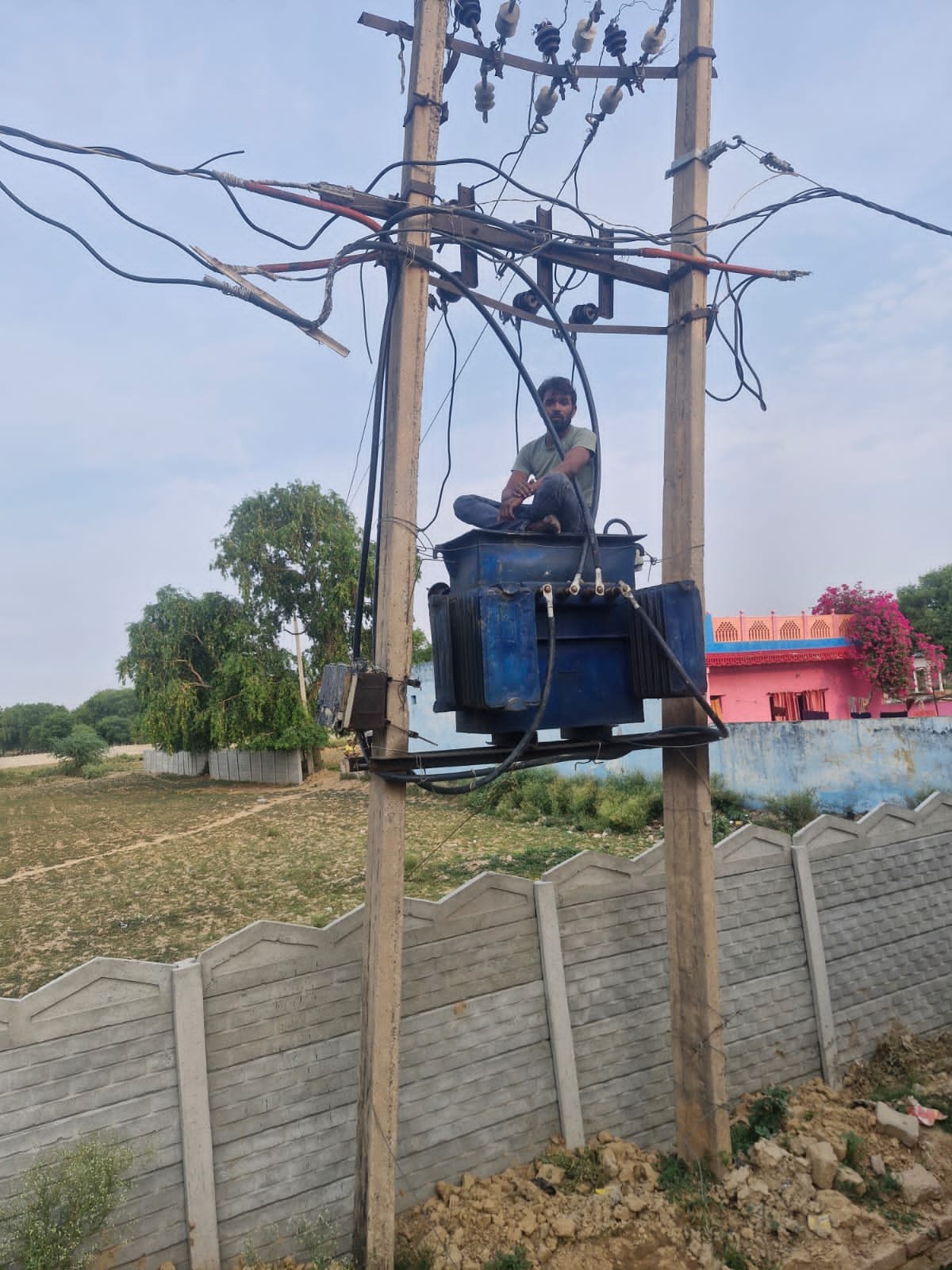 Dauki police officers rescue an intoxicated man from an electric transformer in Chamarpura village, Fatehabad.