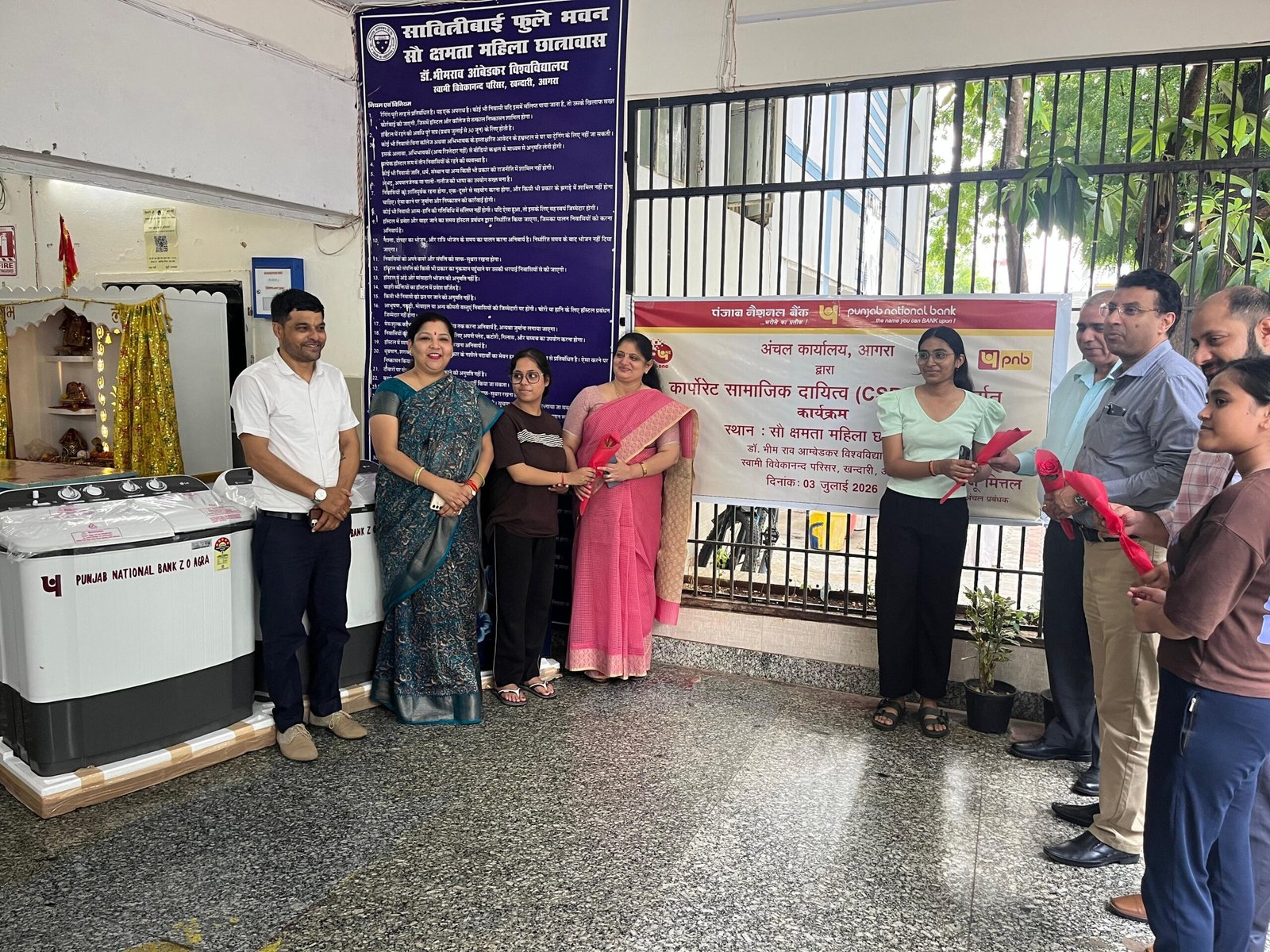 Punjab National Bank officials hand over washing machines and a refrigerator to the girls hostel at Dr Bhimrao Ambedkar University in Agra.
