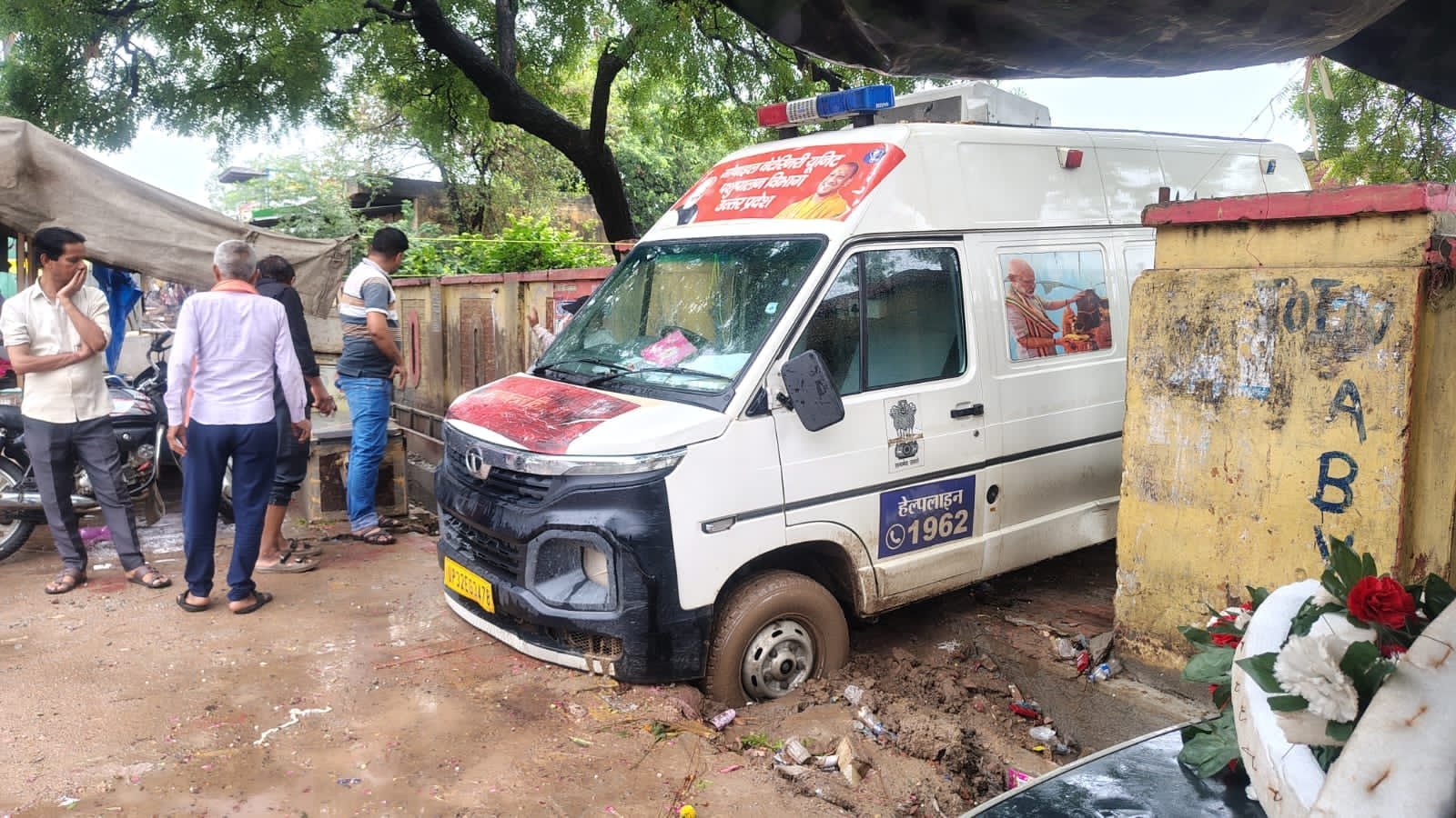 Animal Husbandry Department ambulance stuck in an under-construction drain outside the veterinary hospital in Fatehabad after heavy rainfall.