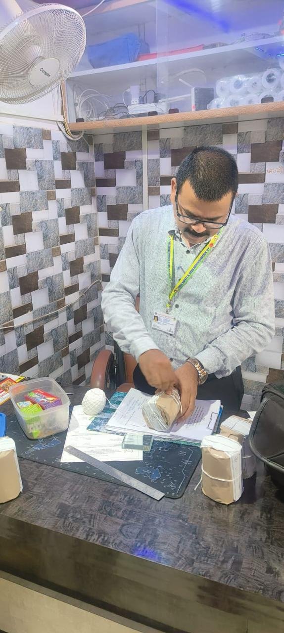 Food Safety officers inspecting spice products and collecting legal samples during a special enforcement drive at a spice manufacturing unit in Agra.