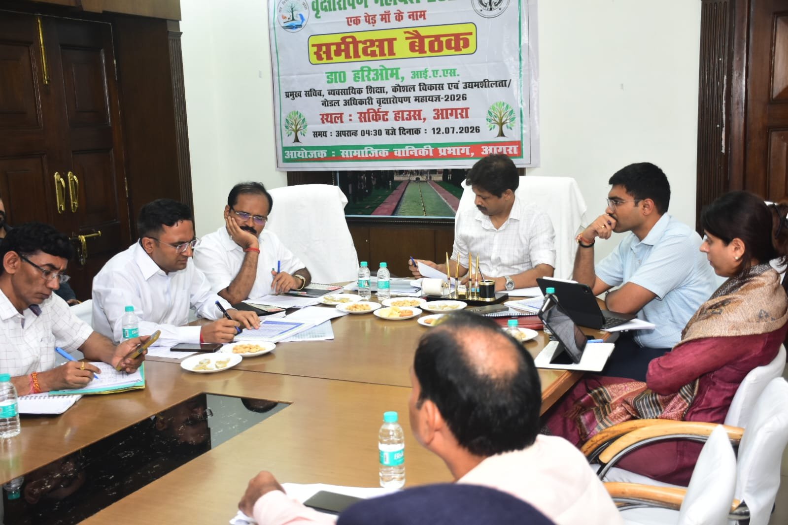 Nodal Officer Dr. Hariom IAS chairs a district-level meeting at Circuit House, Agra, reviewing preparations for the Tree Plantation Mahayagya 2026 with senior administrative officers.