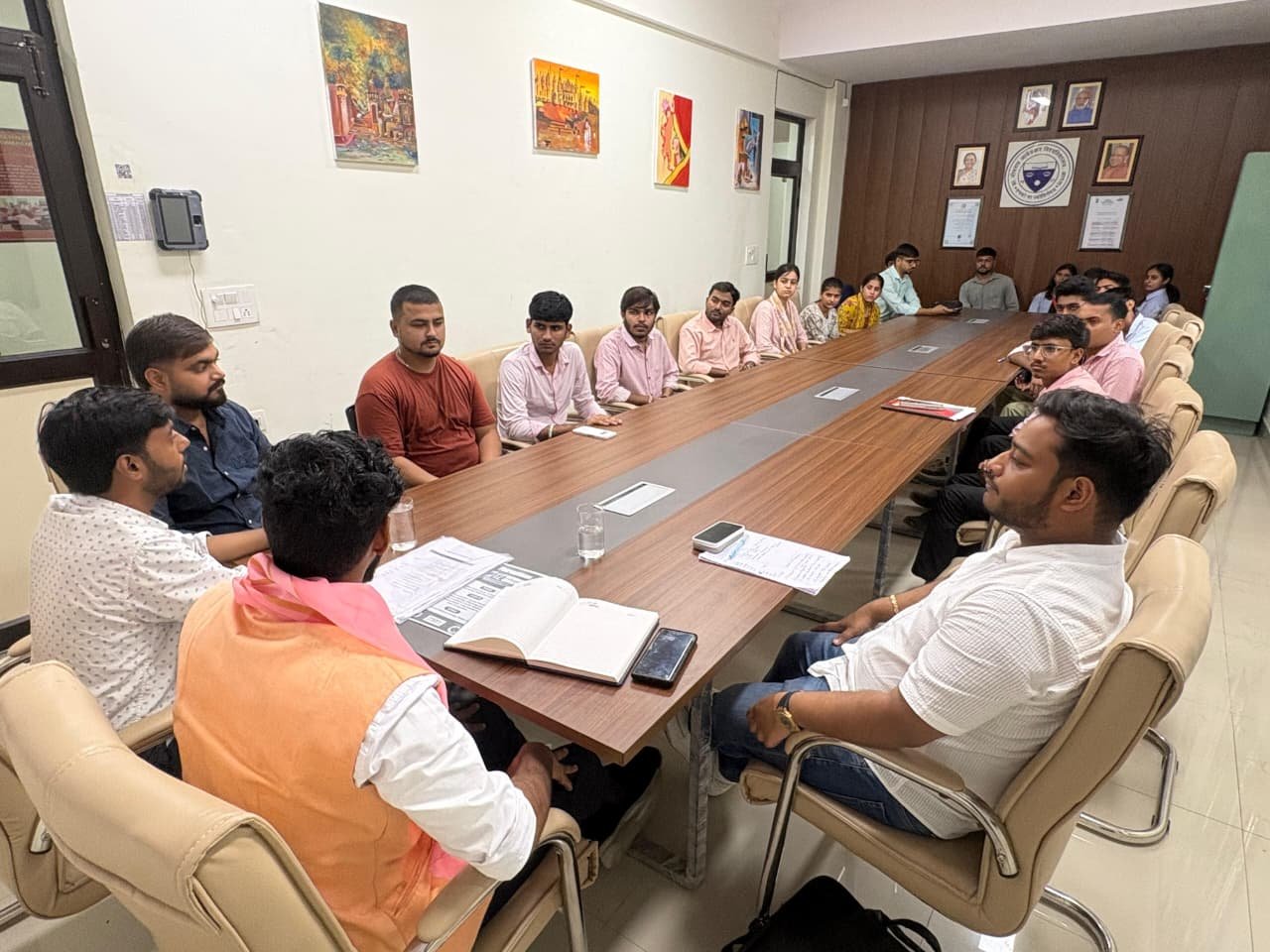 PharmVision representatives addressing pharmacy students during a meeting at the Institute of Pharmacy and Paramedical Sciences, Dr. Bhimrao Ambedkar University, Chhalesar campus.