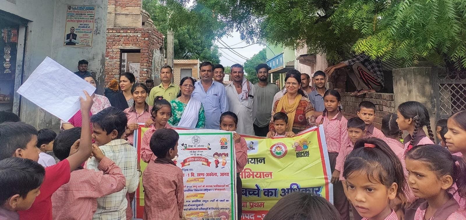 Students of Primary School Kheriya participating in a School Chalo Abhiyan awareness rally and street play to encourage enrollment in government schools in Agra.