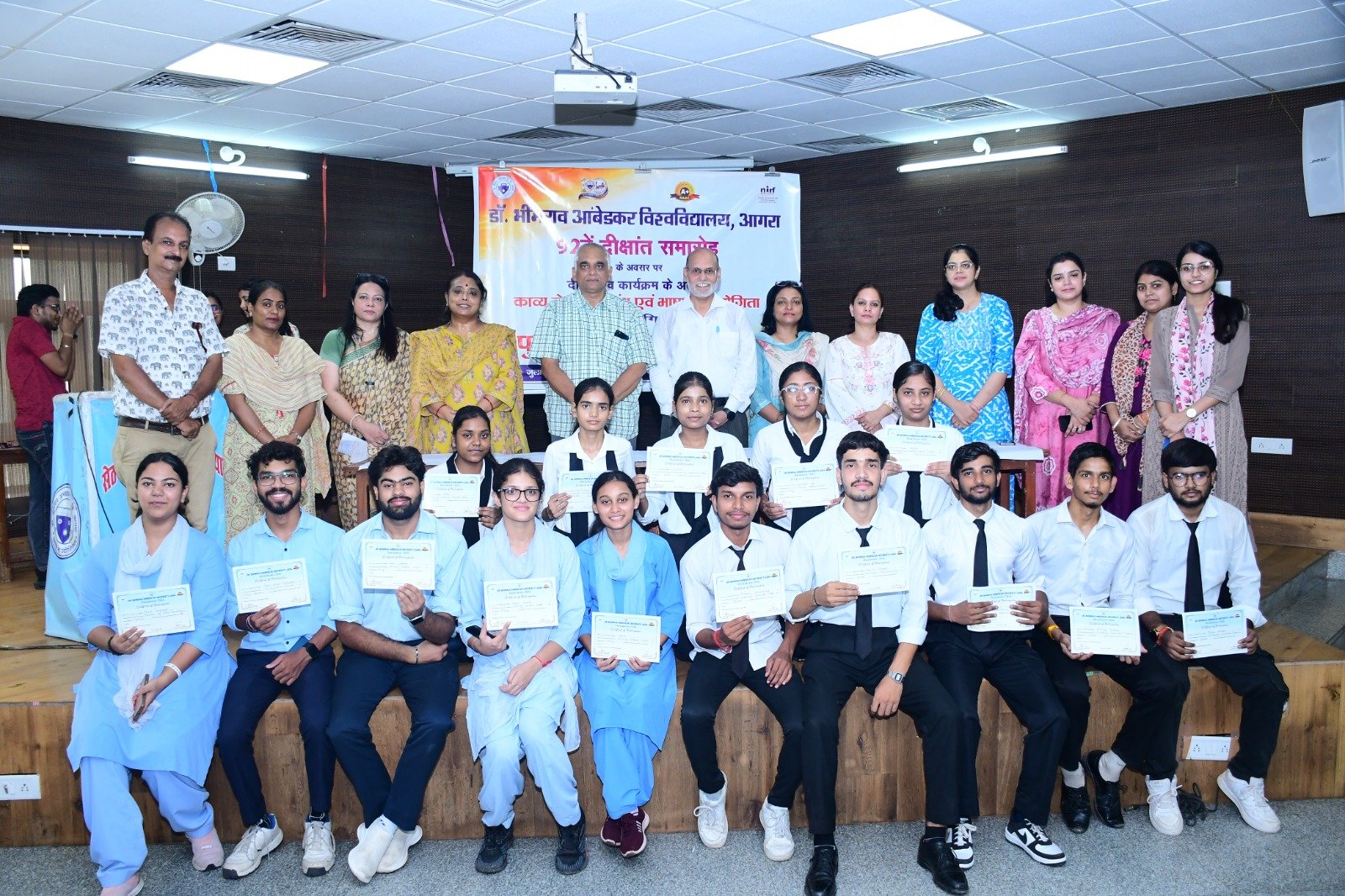 Students receiving awards during Dikshotsav 2026 literary and cultural competition prize distribution at Seth Padam Chand Jain Institute, Agra