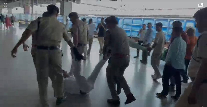 RPF personnel allegedly dragging Deputy Station Manager Narendra Singh Chahar during an incident at Agra Cantt Railway Station.