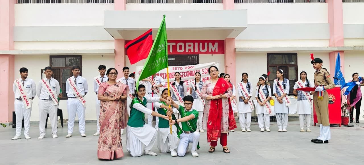 Principal of Police Modern School Agra with newly elected Head Boy Anubhav, Head Girl Aakriti and student council members during the investiture ceremony