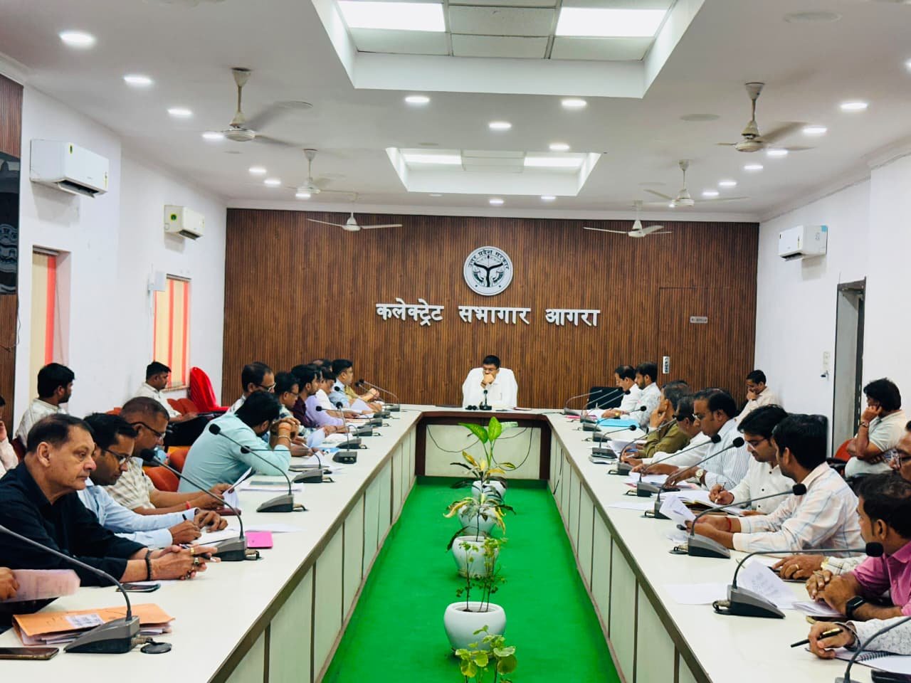 District Road Safety Committee meeting chaired by Agra DM Manish Bansal discussing No Helmet No Fuel policy and traffic safety measures