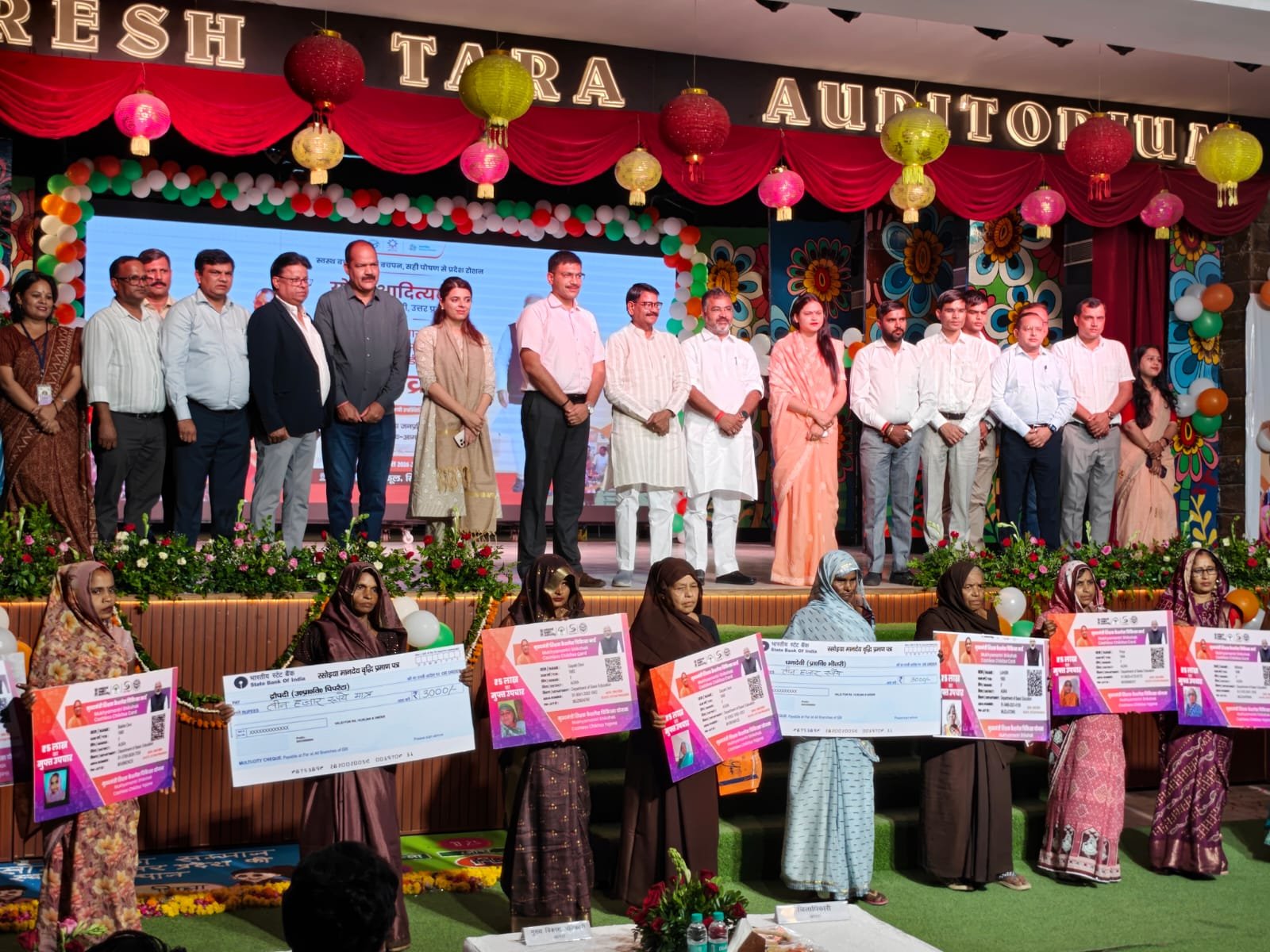 Honored cooks with DM Manish Bansal during the PM Poshan Scheme program in Agra