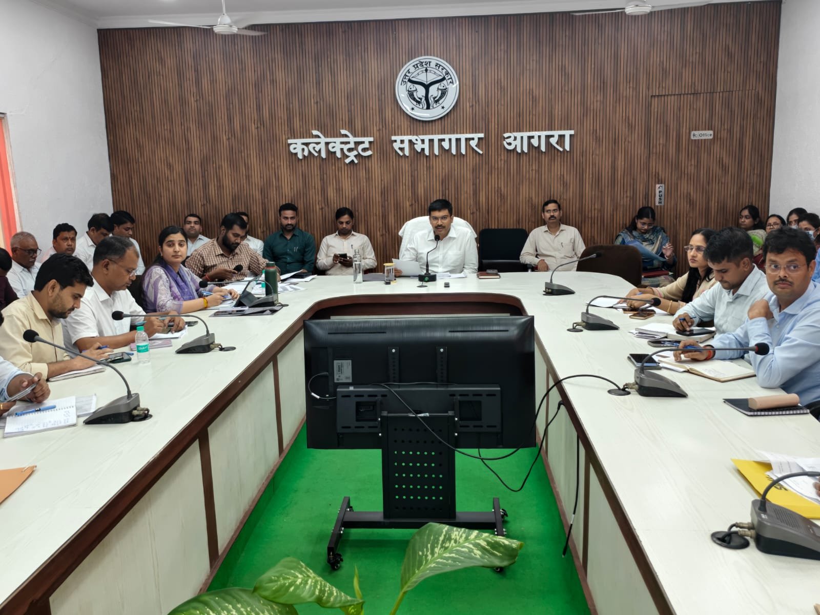 Agra DM Manish Bansal reviewing IGRS complaints during a meeting at the Collectorate