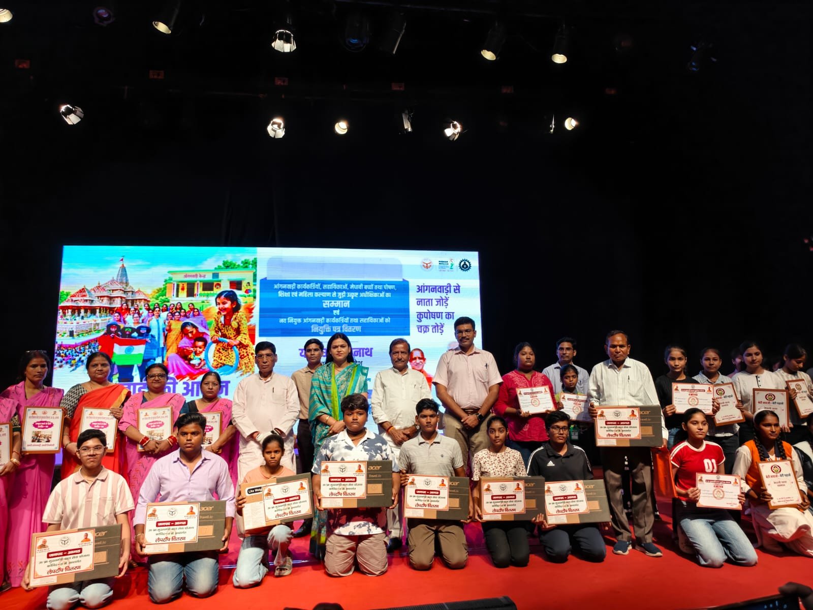 Anganwadi workers and beneficiaries honored during a government program at Sur Sadan Agra