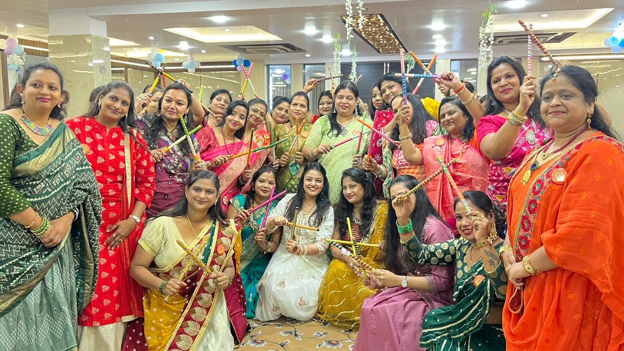 Women celebrating Nandotsav and swinging Lord Krishna's cradle in Agra