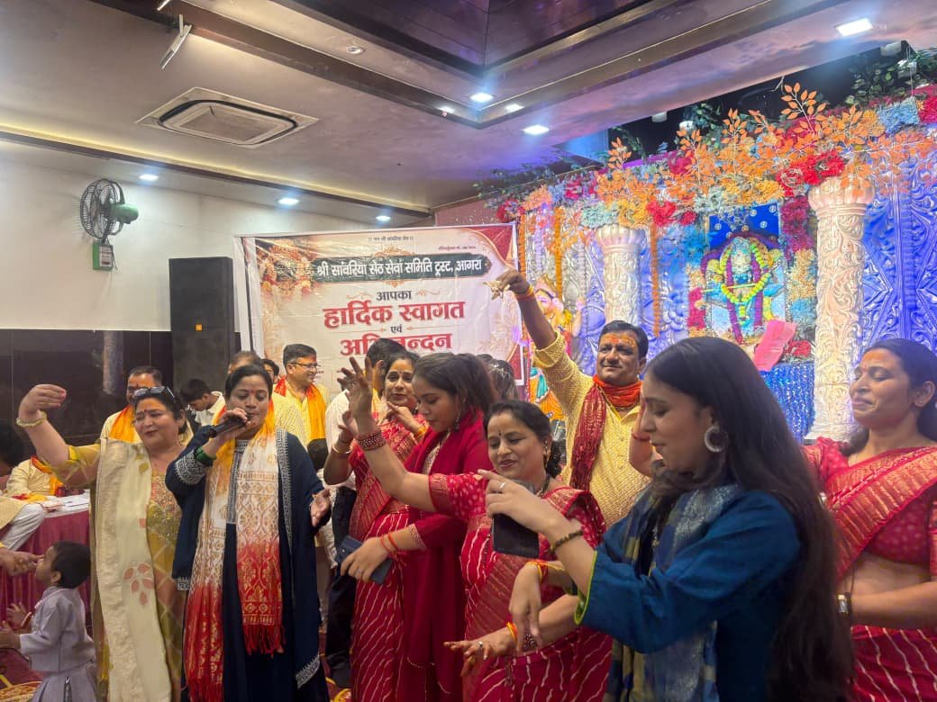 Women devotees dancing to devotional bhajans during a religious event