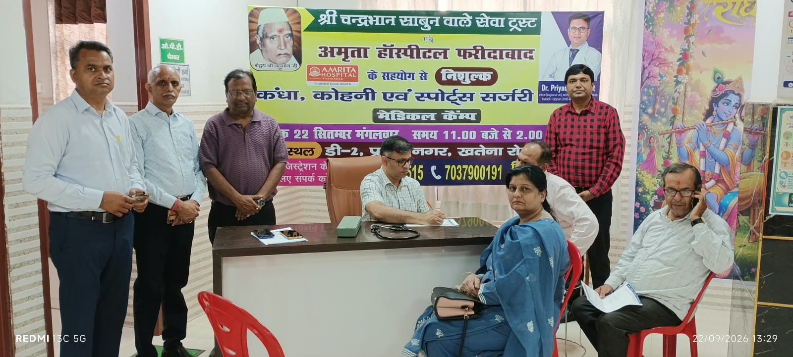 Doctor Priyadarshi Amit examining patients at a free shoulder, elbow and sports surgery medical camp