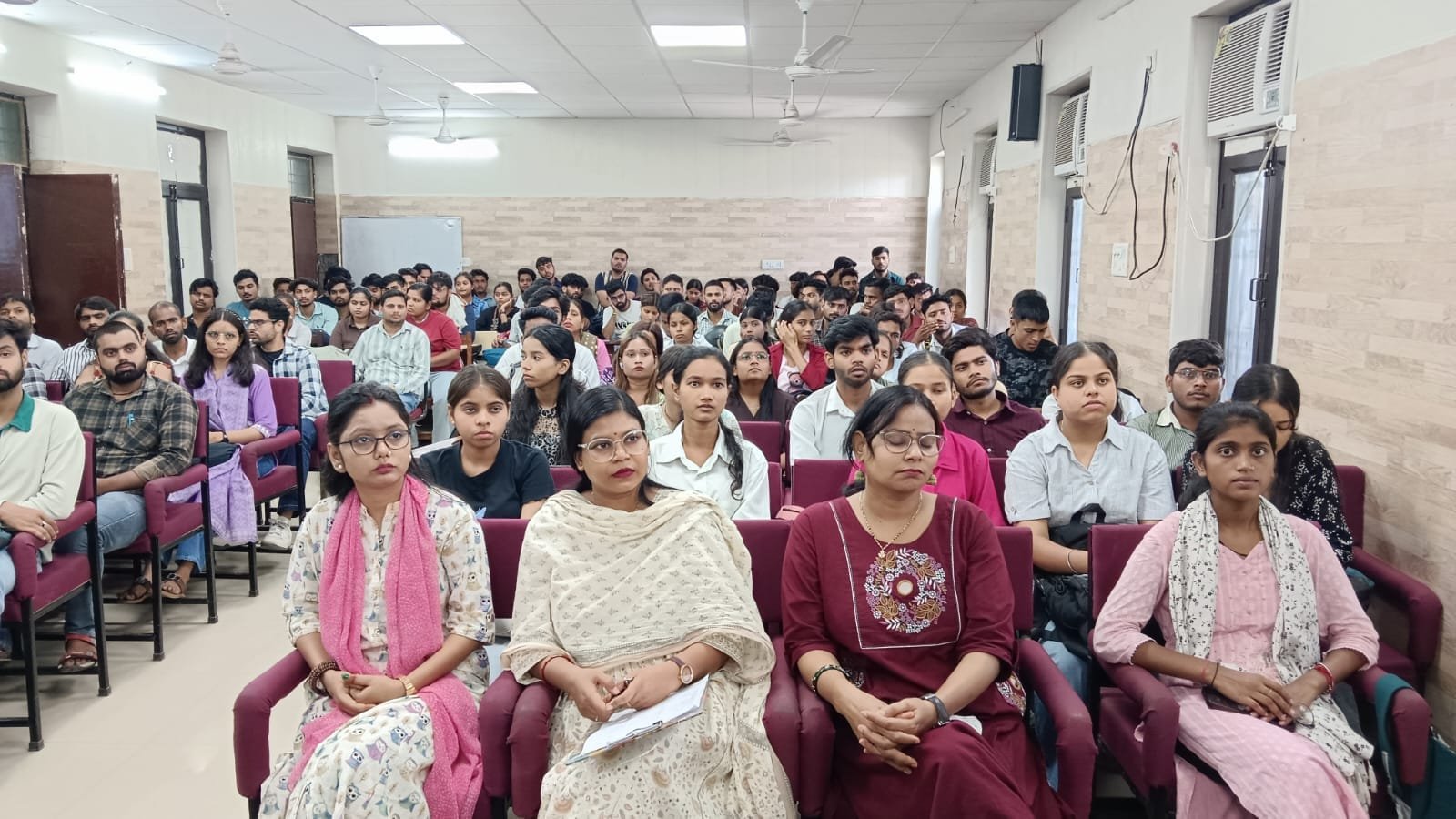 Students attending an IAS and PCS competitive exam guidance session at Agra University