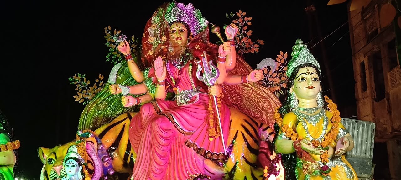 Devotees participating in the grand Maa Narayani Devi Shobhayatra with religious tableaux