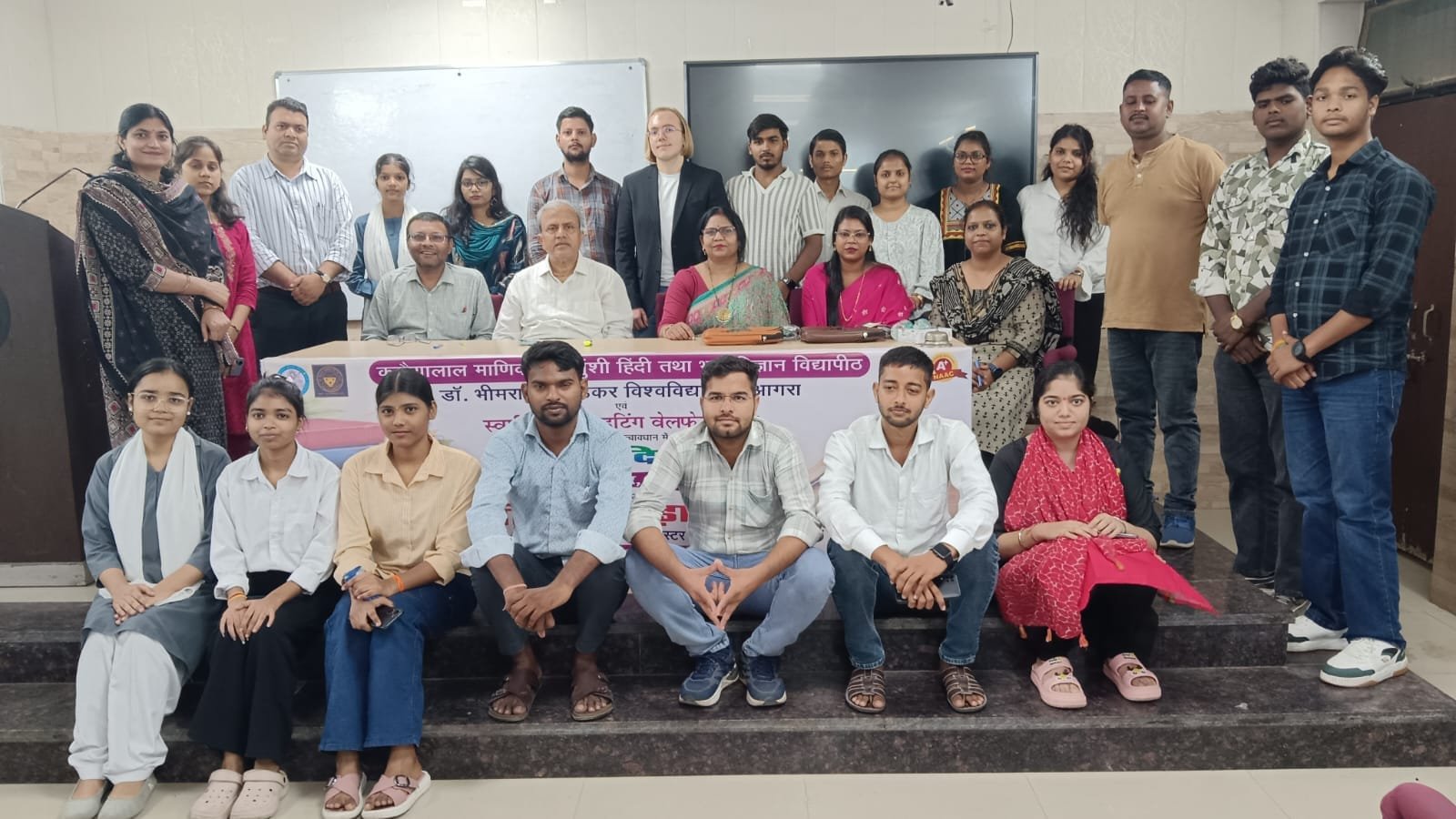 Students participating in a quick speech competition on Hindi Diwas at KMI Agra