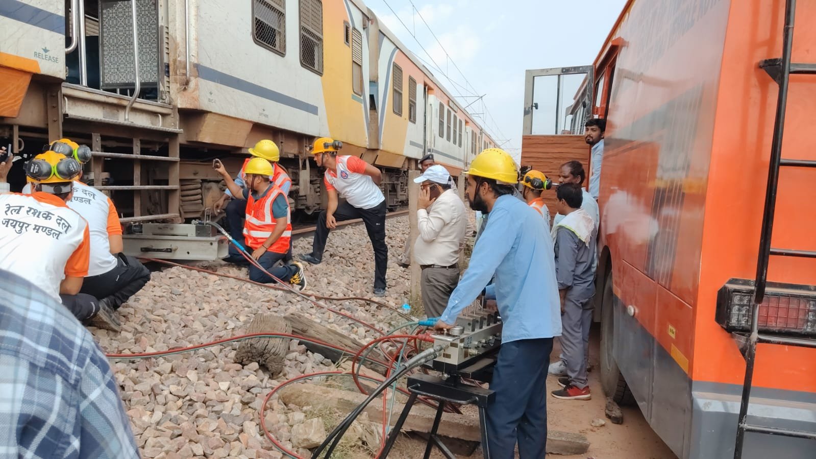 Railway rescue team working to bring the derailed Eidgah-Bandikui MEMU train coach back onto the tracks.