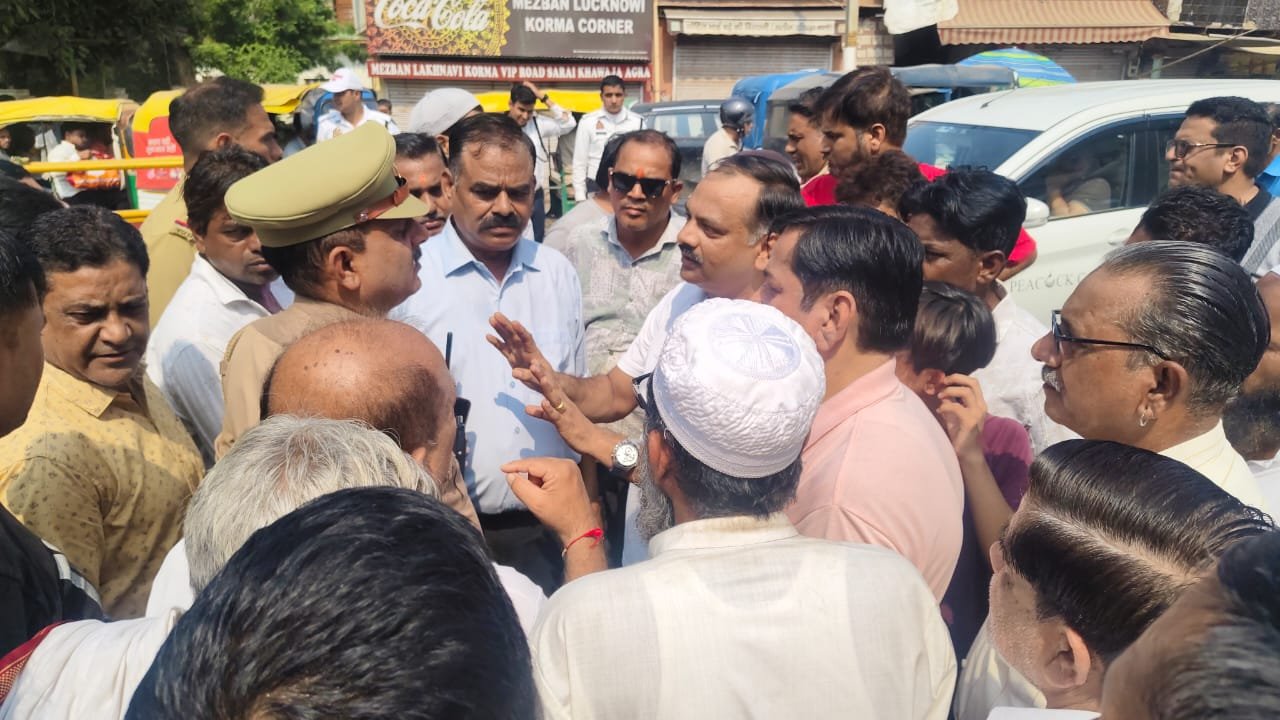 Ajit Nagar Market Committee members protesting the proposed 90-day closure of Eidgah-Kheria Road Overbridge in Agra and demanding improved alternative routes.
