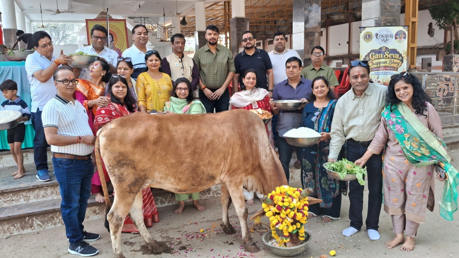 Lions Club Conroy members performing Gau Puja and offering Chhappan Bhog at a cowshed in Water Works, Agra