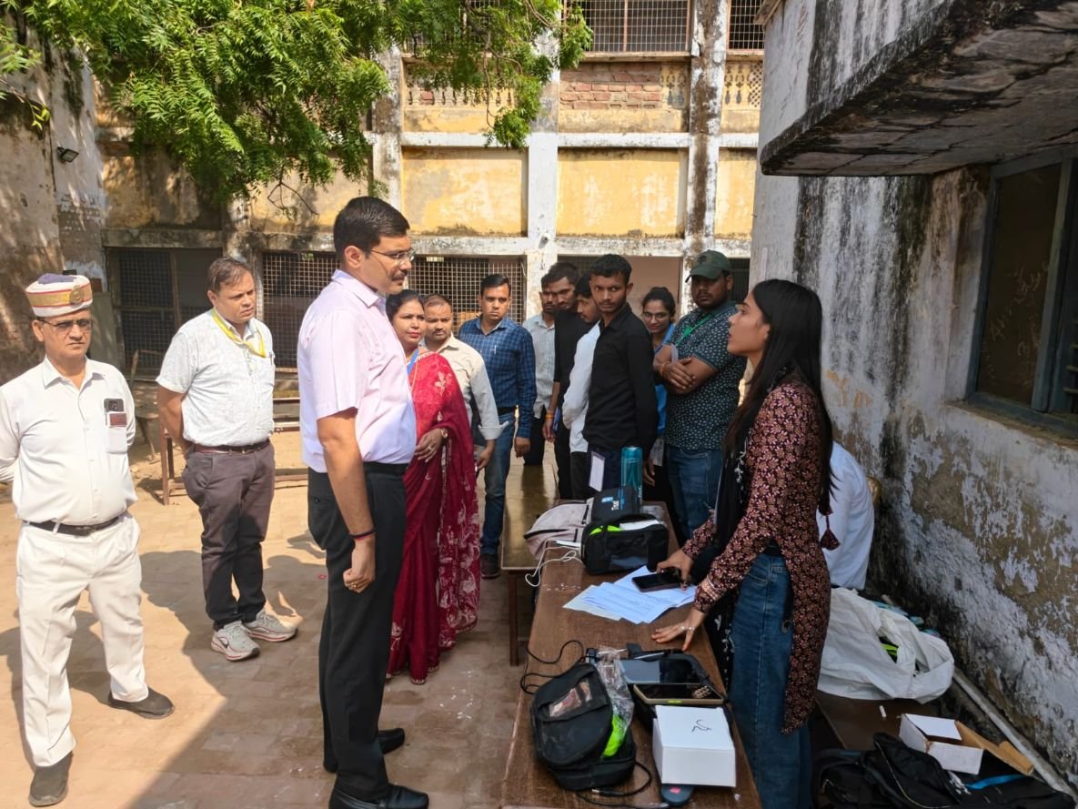 Agra DM Manish Bansal interacting with PET-2026 candidates at an examination centre in Agra