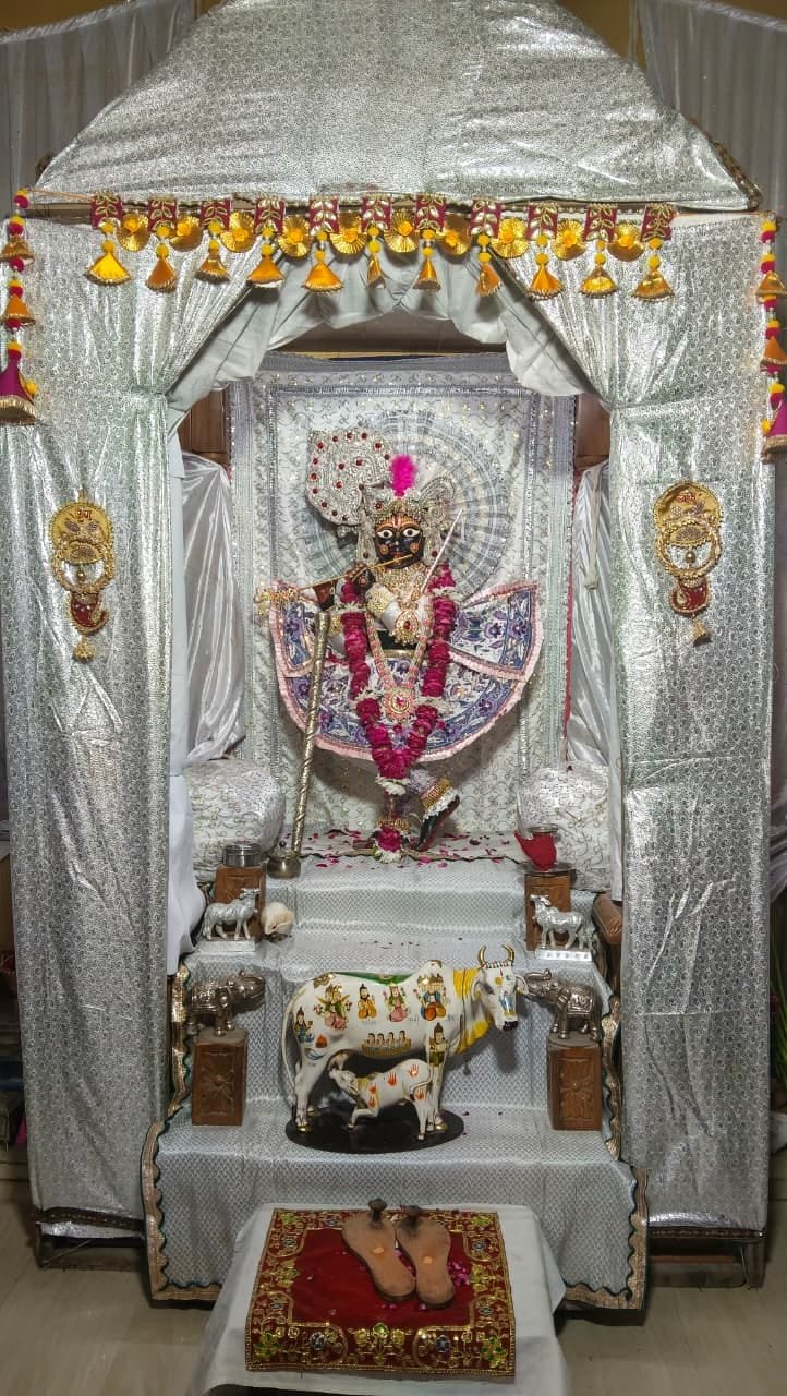 Lord Krishna adorned in white attire with flute at Premnidhi Temple Agra on Sharad Purnima