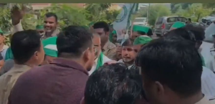 City Magistrate Amit Kumar falls during a scuffle between Bhartiya Kisan Union workers and police in Agra’s Nai Ki Mandi area.